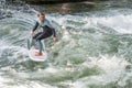 MUNICH - AUGUST 08: An unidentified female surfer works the wave at the Surf & Style August 08, 2015 in Munich